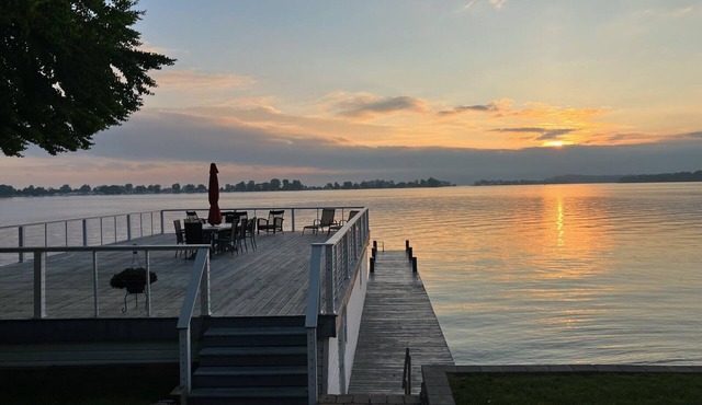 Beautifully updated home on the bay and golf course with dock and raised deck! in Sodus Point