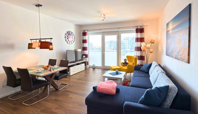Stylish "Ankerplatz" Vacation Rental in Bremerhaven. Balcony with a beach chair and a breathtaking view of the harbor. Ultimate sleeping comfort in a high-quality box spring bed. Home Charging Station for Electric Cars in Bremerhaven