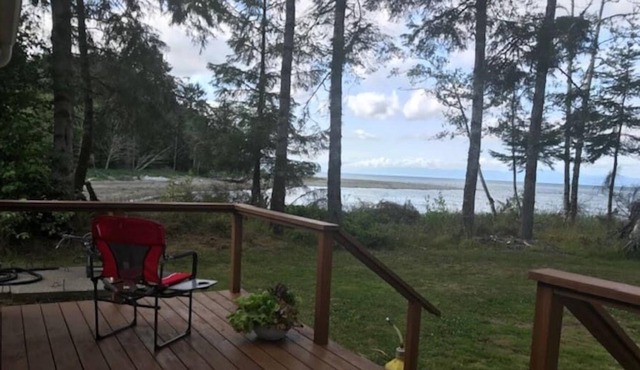Walk out the front door, across a grass lawn and onto a sandy beach in Sekiu